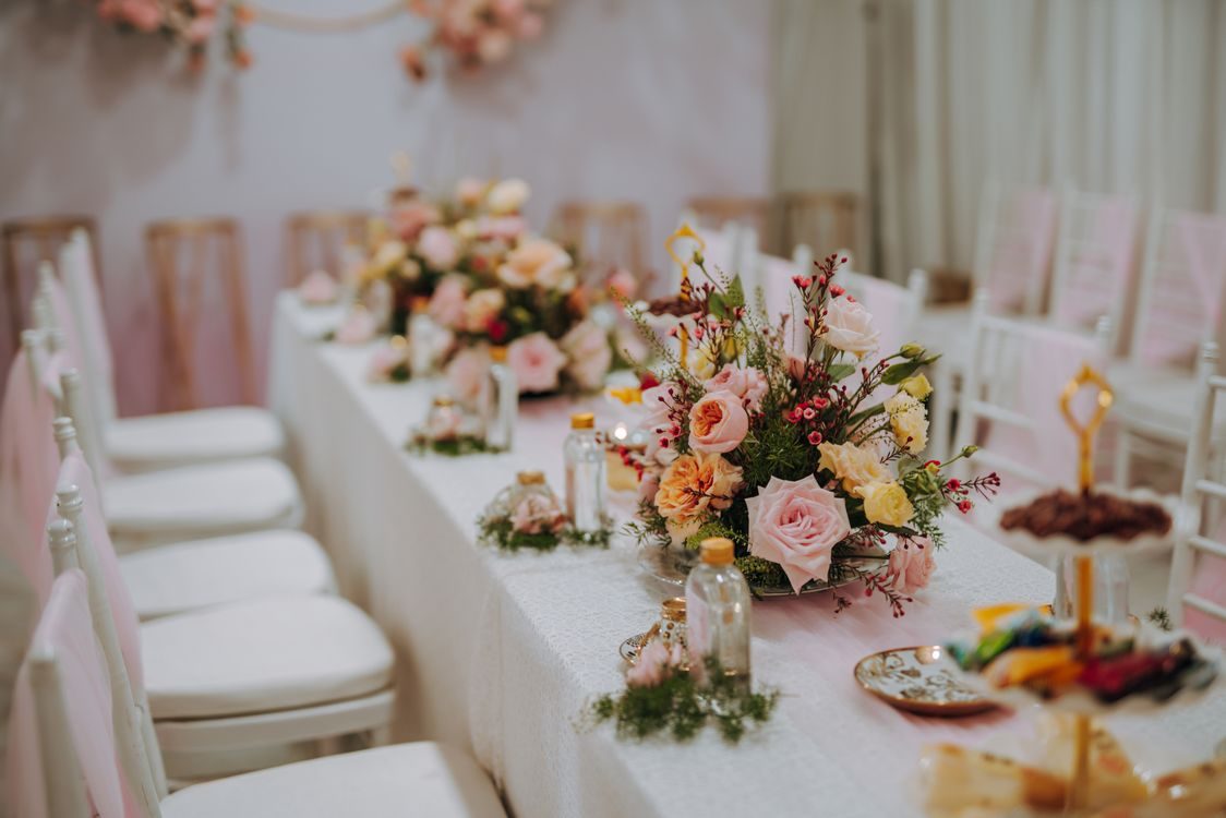 Blush wedding head table with floral details